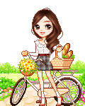A woman's hair rustles gently in the breeze as she stands with  her bike on a pathway. She holds a basket filled with baguettes.