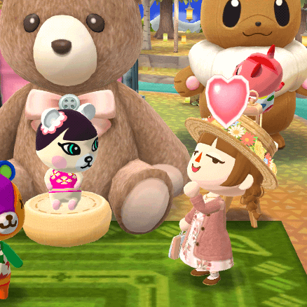 A cute bear villager sits in front of a large teddy bear, while a girl nearby looks lovestruck.